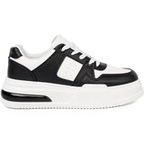 Shelvt Stylish black and white sneakers with a thick sole Cene