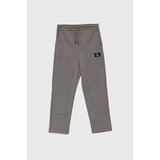 Calvin Klein Jeans Otroški spodnji del trenirke siva barva | Shoptok.si