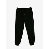 Koton Textured Jogger Sweatpants with a drawstring waist and pockets. Cene