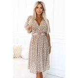numoco basic 604-3 Sensual dress with white polka dots, a wrap neckline and a decorative belt - beige Cene