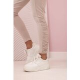 Kesi Women's trousers with a frill on the sides beige | shoptok.hr