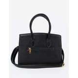 Shelvt Black handbag with a decorative buckle in gold | ePonuda.com