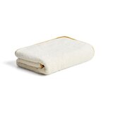 Kave Home Rumena/bela frotirna bombažna brisača 70x140 cm Sedora – Cene