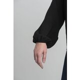 FASHION Black oversize blouse with a decorative flower | Eponuda.com