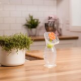 Haakaa ročna črpalka silikonska 2. gen 100 ml + pokrovček oranžna rožica | Shoptok.si