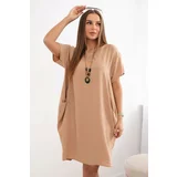 Kesi Dress with pockets and a Camel pendant