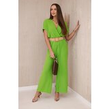 Kesi Jumpsuit with a decorative belt at the Pistachio waistband Cene