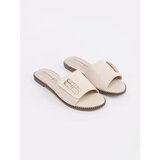 GOODIN Light beige women's flip-flops on a flat sole | Shoptok.si