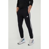 Adidas Pamučni donji dio trenirke boja: crna, s aplikacijom | shoptok.hr