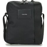 Calvin Klein Jeans Torbice CK MUST T REPORTER Črna | Shoptok.si