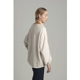 FASHION Beige oversize blouse with a decorative flower | shoptok.hr