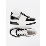 Shelvt Black and white sneakers with shimmering silver details | ePonuda.com