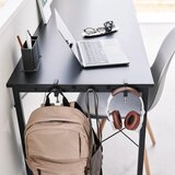 YAMAZAKI Mat črn jeklen nastavljiv obešalnik Tower – | Shoptok.si