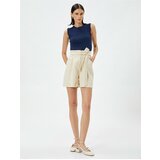Koton Silky-textured shorts with a belt and pockets. Cene