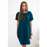 Kesi Dress with pockets and a navy pendant