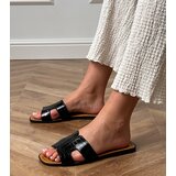 D/CEO Black flat-soled flip-flops with Sarini embossing | ePonuda.com
