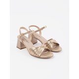 GOODIN Golden elegant sandals on a low heel | Shoptok.si