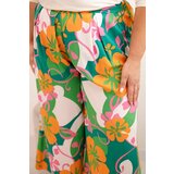 Kesi Włoski Women's Plus Size viscose trousers with floral pattern orange | Shoptok.si