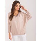 Fashion Hunters Beige women's oversize blouse with neckline Cene