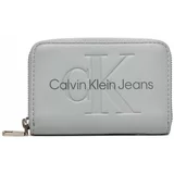Calvin Klein Jeans Majhna ženska denarnica Sculpted Med Zip Around Mono K60K612255 Siva