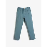 Koton Trousers with a tie waist and elasticated pockets, and skinny legs.