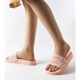 Gemre Ernest's pink sandals adorned with ruffles | Shoptok.si