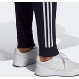 Adidas Športne hlače 'Essentials Fleece Tapered Cuff 3-Stripes' modra / bela | Shoptok.si
