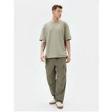Koton Cargo Parachute Loose Trousers with Elastic Waist Pocket Detail and Stoppers Cene