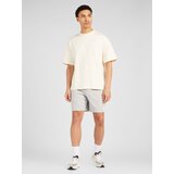 New Balance Hlače siva melange / bijela | shoptok.hr