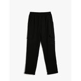 Koton Cargo Trousers have an elasticated waist, pocket detail, and fold over legs. | shoptok.hr