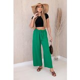 Kesi Wide-waisted trousers in green colour Cene