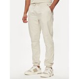 Tommy Jeans Jogging hlače Austin DM0DM19457 Bež Regular Fit | Shoptok.si