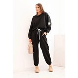 Kesi Włoski Ladies' butter set with a loose sweatshirt and pants with the word LOVE black | Shoptok.si