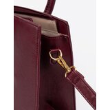 Shelvt Burgundy handbag with a decorative buckle in gold | ePonuda.com