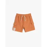 Koton The shorts are tied at the waist, elasticized, side pockets, textured cotton.