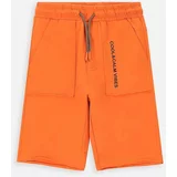 Coccodrillo Otroške bombažne kratke hlače oranžna barva
