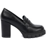 Shelvt Black loafers on a post with a trapper sole Cene