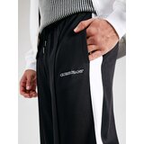 Guess Jeans Spodnji deli trenirke TRICOT TRACK PANT Črna | Shoptok.si