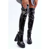Kesi Leather boots for the knee on a massive pillar of a black bouquet
