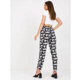 Fashion Hunters Black light trousers made of fabric with flowers SUBLEBEL Cene