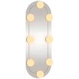 vidaXL Stensko ogledalo z LED lučmi 15x40 cm stekleno ovalno | Shoptok.si