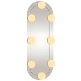 vidaXL Zidno ogledalo s LED svjetlima 15 x 40 cm stakleno ovalno | shoptok.hr