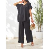 Resti Women's set with short sleeves, decorative flower, and wide pants Cijene