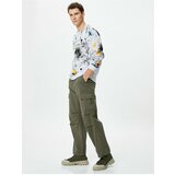 Koton The Parachute Trousers are in a loose fit with Stopper Cargo with Pocket Detail. Cene