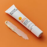 Super Facialist Vitamin C+ Brighten posvetlitvena krema za predel okoli oči proti zabuhlosti in temnim kolobarjem 15 ml | Shoptok.si