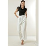 By Saygı A snap fastener at the waist, Pockets and Wide Leg Trousers. Cene