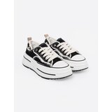 Shelvt Black women's sneakers with white inserts | Shoptok.si