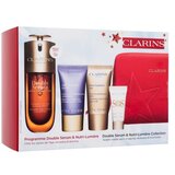Clarins Double Serum & Nutri-Lumière Collection set: serum za obraz Double Serum 50 ml + dnevna krema za obraz Nutri-Lumiere Revive 15 ml + nočna krema za obraz Nutri-Lumiere Nuit 15 ml + podlaga za ličila SOS Primer 5 ml + rdeča kozmetična torbica za ženske | Shoptok.si