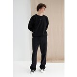 Trendyol Black Men's More Sustainable Oversize Sweatpants with Pocket, Textured Fabric Detail. Cene