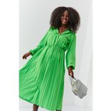 FASARDI Elegant green dress for women with pleated hem Cene